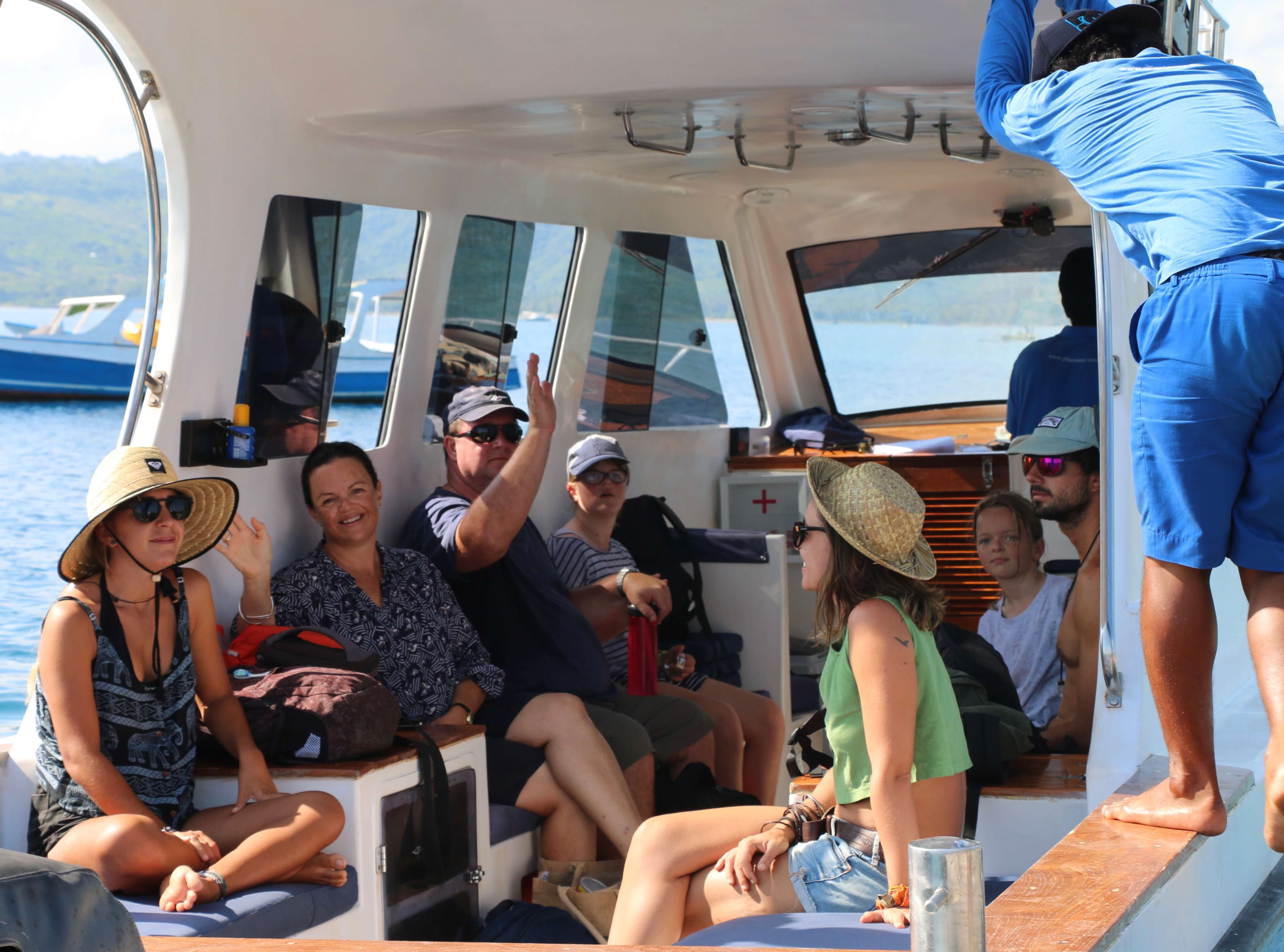 Passengers seated inside a Gili Getaway boat cabin
