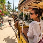 Woman smile going on with cidomo around gili trawangan