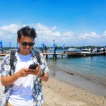 asian traveller at serangan port