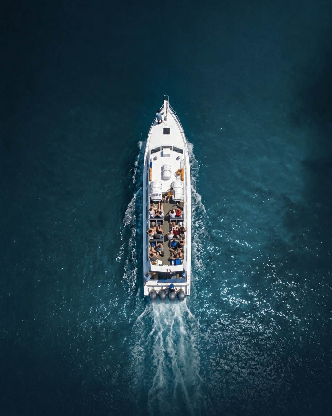Aerial view of a Gili Getaway boat cruising with passengers on deck