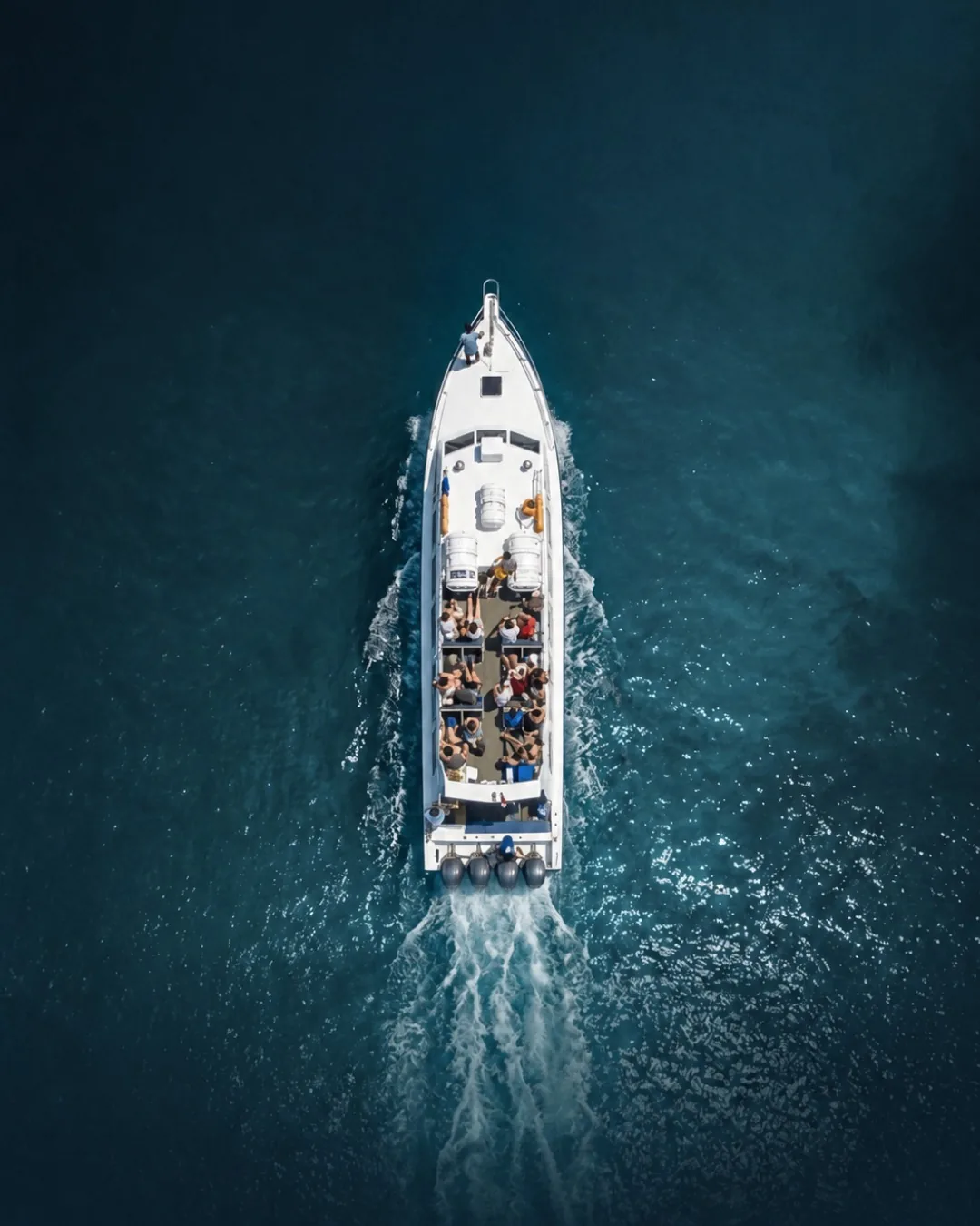 Aerial view of a Gili Getaway boat cruising with passengers on deck